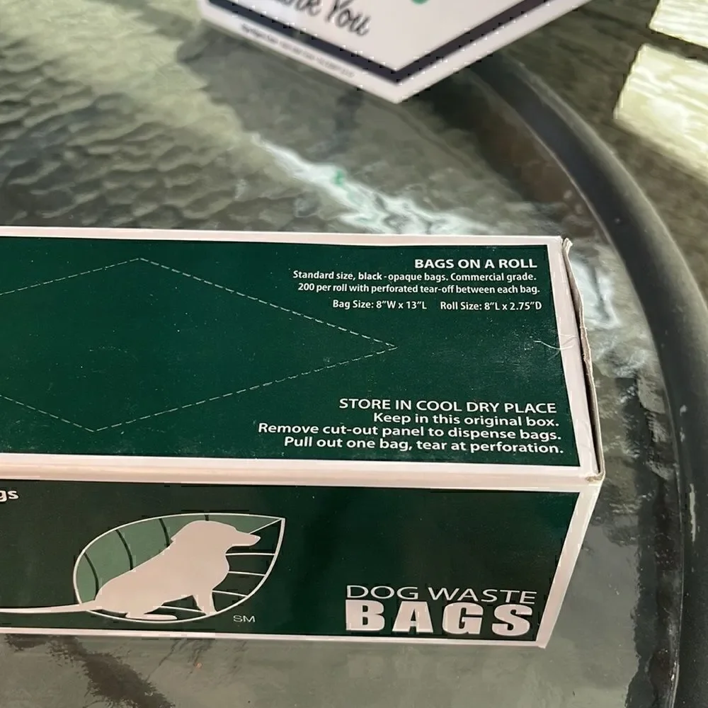 Dog waste bag and sign. Please be a good neighbor, clean up after your dog. New
